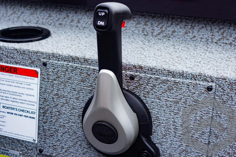 Slide: The Image of Close-up of 2025 G3 Sportsman 1810 boat throttle control lever. - 44