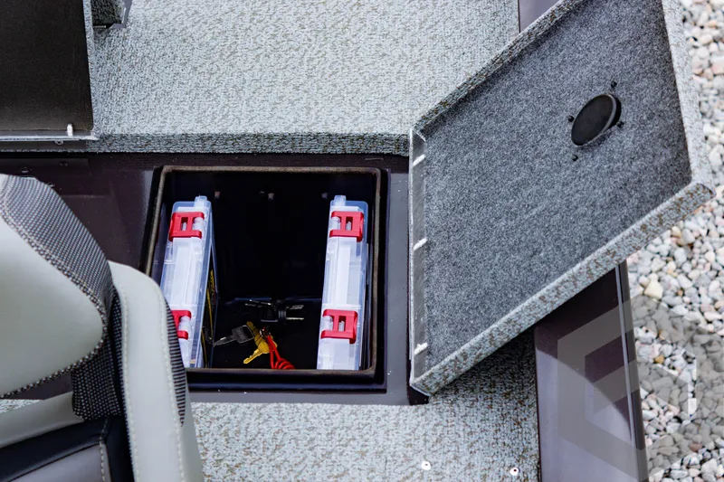 Slide: The Image of 2025 G3 Sportsman 1810 boat storage compartment with battery holders. - 47