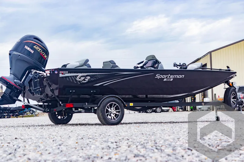 Slide: The Image of 2025 G3 Sportsman 1810 boat with Yamaha engine on a trailer, parked outdoors. - 5