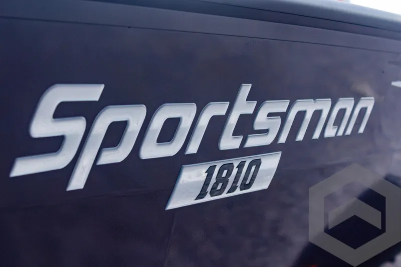 Slide: The Image of Close-up of 2025 G3 Sportsman 1810 logo on boat exterior. - 8