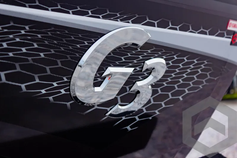 Slide: The Image of 2025 G3 Sportsman 1810 boat with hexagonal pattern and bold logo. - 9
