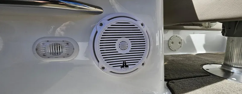 Slide: The Image of Speaker and light fixture on a 2006 Cobalt 240 boat interior. - 8