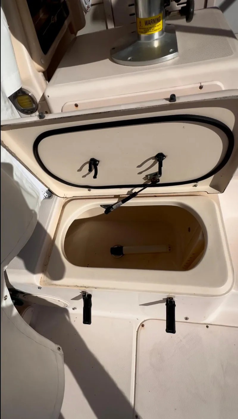 Slide: The Image of Open storage compartment on 2006 Grady-White 282 Sailfish boat. - 13