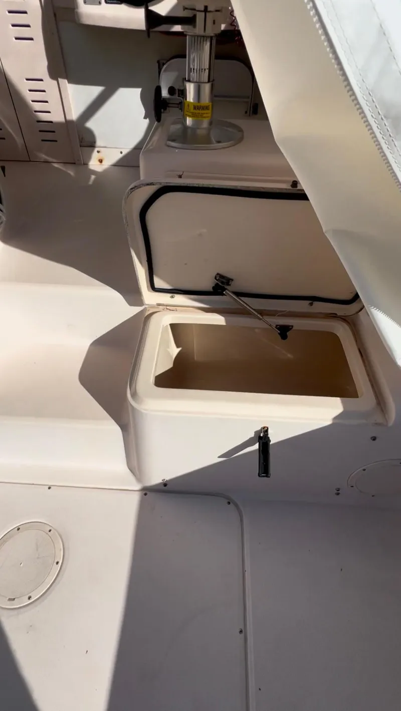 Slide: The Image of 2006 Grady-White 282 Sailfish boat interior with open storage compartments. - 14