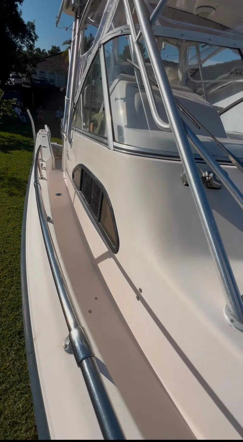 Slide: The Image of 2006 Grady-White 282 Sailfish boat, side view with sleek design and sturdy railing. - 15