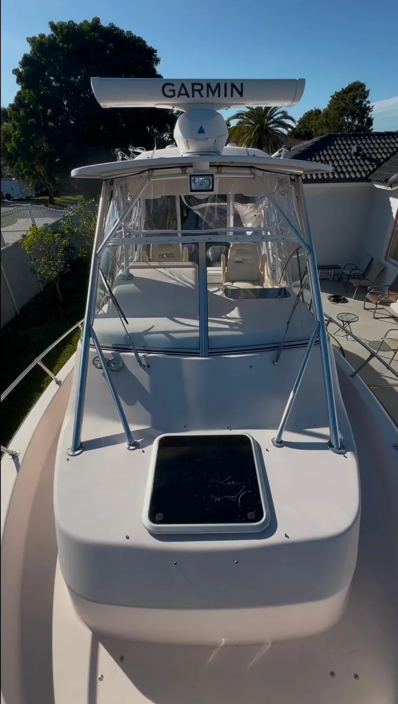 Slide: The Image of 2006 Grady-White 282 Sailfish boat with Garmin radar, docked outdoors. - 3
