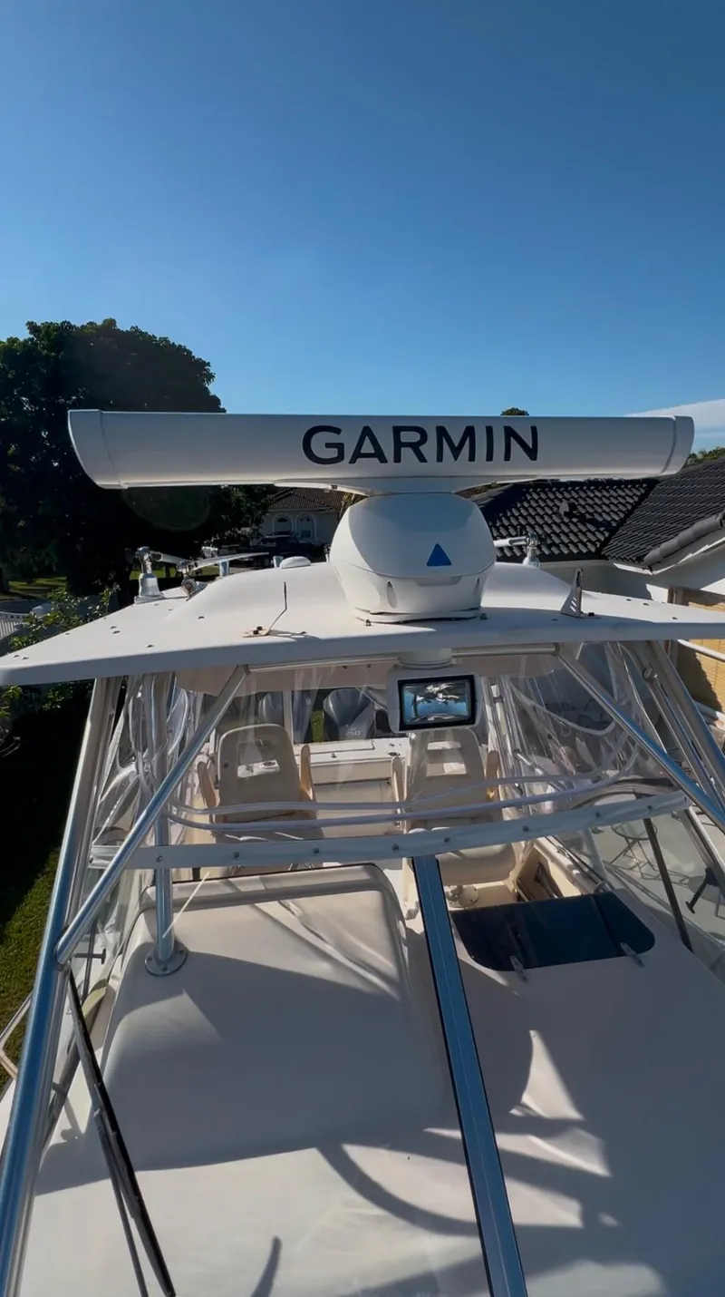 Slide: The Image of 2006 Grady-White 282 Sailfish boat with Garmin radar under clear blue sky. - 6