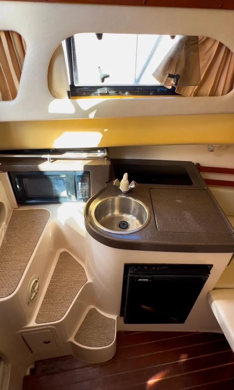 Slide: The Image of 2006 Grady-White 282 Sailfish boat interior with kitchenette and sink. - 8