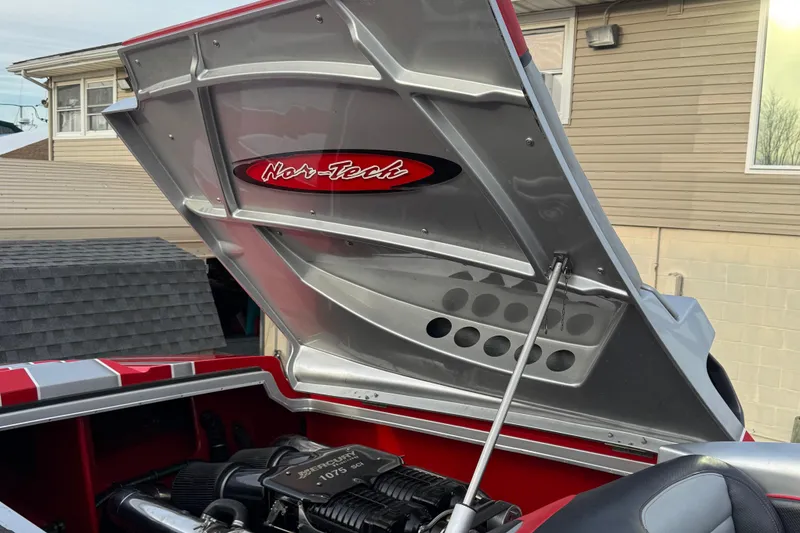 Slide: The Image of 2010 Nor-Tech 4000 Roadster engine compartment with open hood. - 14