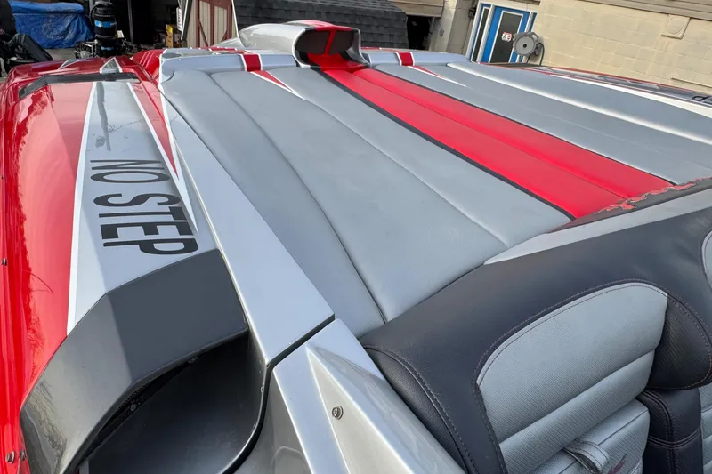 Slide: The Image of 2010 Nor-Tech 4000 Roadster with red and gray detailing, "No Step" warning visible. - 16