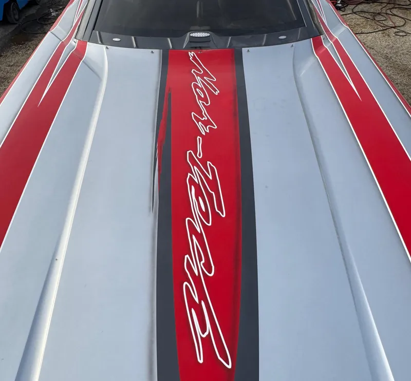 Slide: The Image of 2010 Nor-Tech 4000 Roadster with sleek red and gray design. - 17