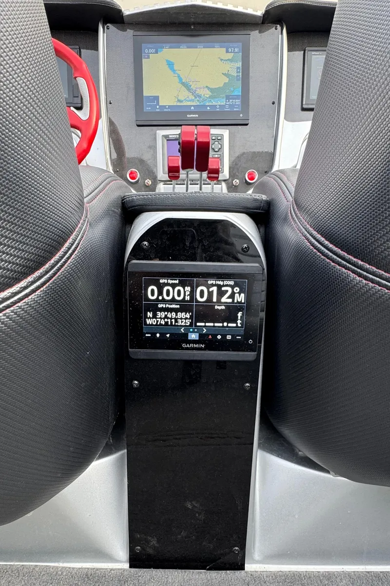Slide: The Image of Dashboard of 2010 Nor-Tech 4000 Roadster with navigation and control systems. - 25