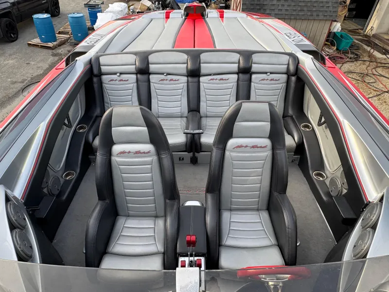 Slide: The Image of Interior of 2010 Nor-Tech 4000 Roadster boat with sleek, modern seating design. - 26
