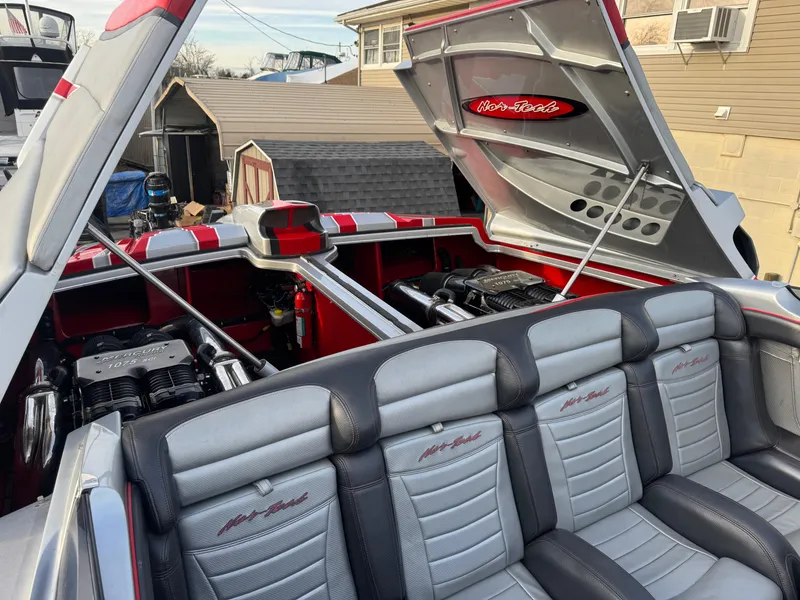 Slide: The Image of 2010 Nor-Tech 4000 Roadster interior with open engine compartment, showcasing luxury seating and powerful engines. - 27