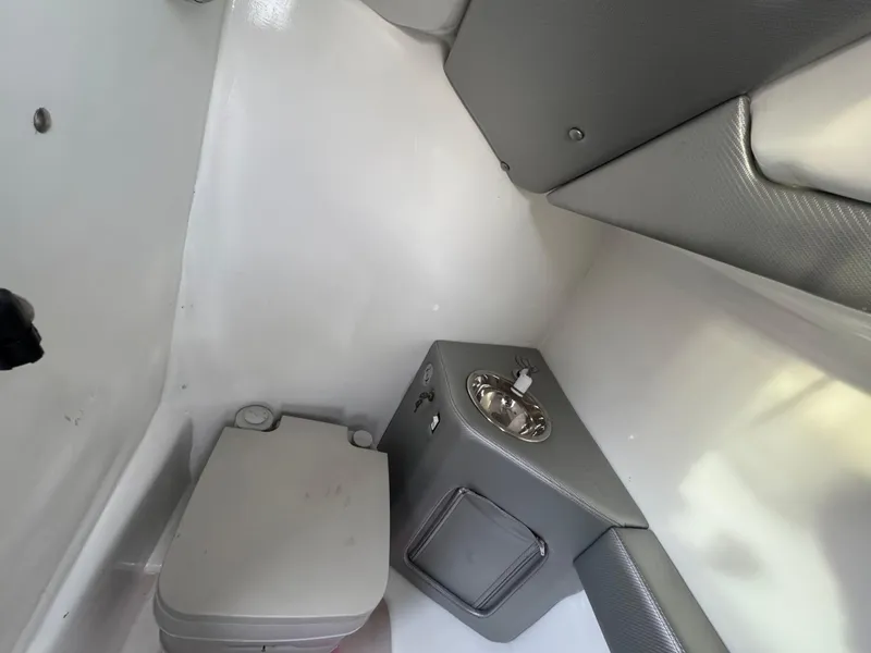 Slide: The Image of 2010 Nor-Tech 4000 Roadster interior cabin with compact toilet and sink. - 33