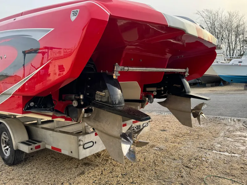 Slide: The Image of 2010 Nor-Tech 4000 Roadster boat with dual propellers on a trailer. - 8