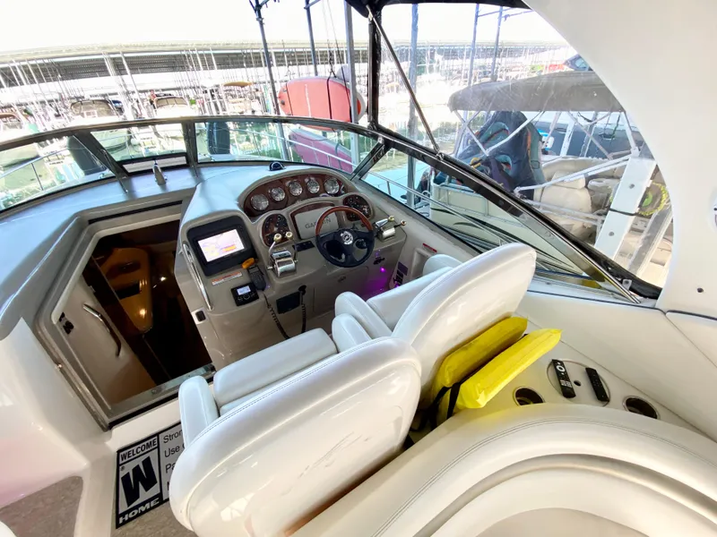 Slide: The Image of 2007 Sea Ray 340 Sundancer cockpit with steering wheel and control panel. - 11