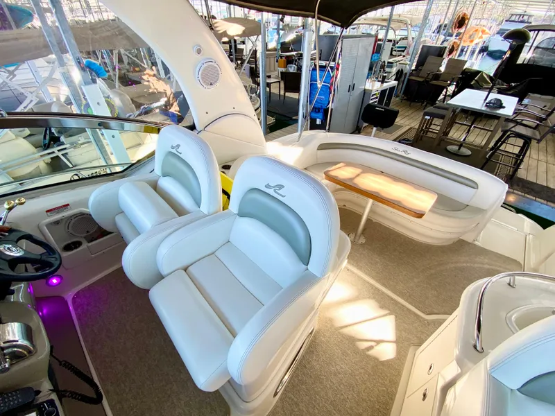 Slide: The Image of 2007 Sea Ray 340 Sundancer cockpit with plush seating and modern design. - 12