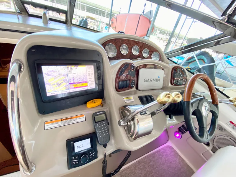 Slide: The Image of 2007 Sea Ray 340 Sundancer helm with Garmin navigation and control panel. - 15