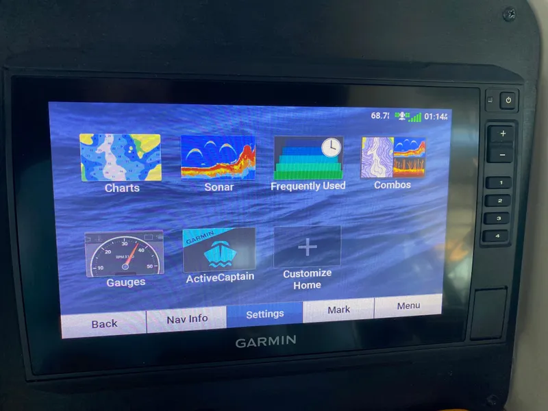 Slide: The Image of Garmin marine navigation display on 2007 Sea Ray 340 Sundancer showing charts and sonar options. - 18