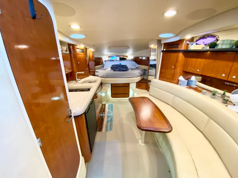 Slide: The Image of Luxurious interior of 2007 Sea Ray 340 Sundancer yacht with wood finishes and cozy seating. - 20