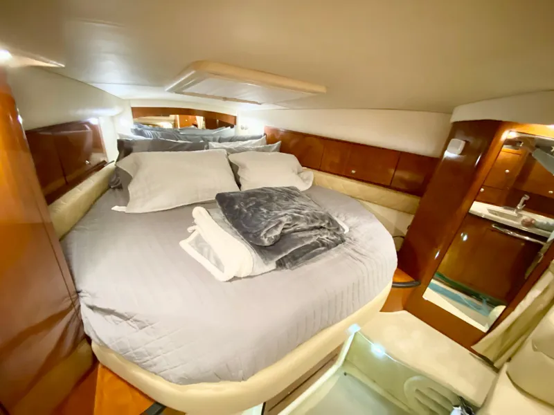 Slide: The Image of Luxurious cabin interior of 2007 Sea Ray 340 Sundancer yacht with cozy bedding. - 23