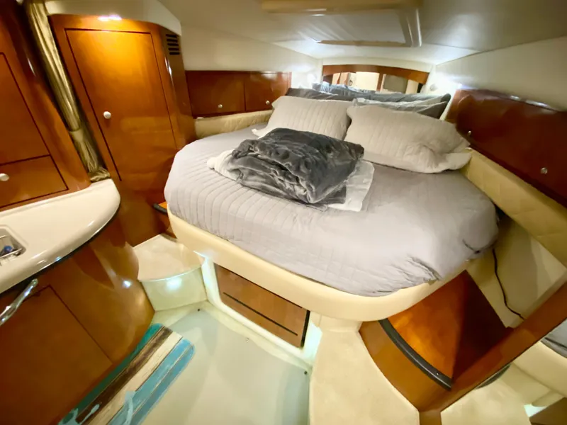 Slide: The Image of Luxurious 2007 Sea Ray 340 Sundancer cabin with cozy bed and elegant wood finish. - 24