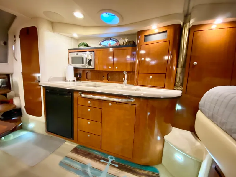 Slide: The Image of Luxurious 2007 Sea Ray 340 Sundancer yacht interior with modern kitchen amenities. - 25