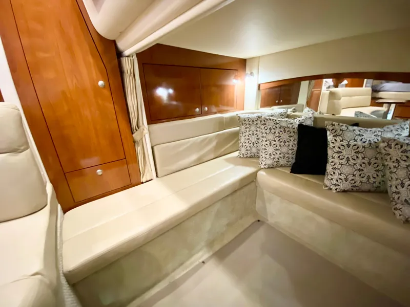 Slide: The Image of Luxurious interior of 2007 Sea Ray 340 Sundancer with plush seating and elegant wood paneling. - 28
