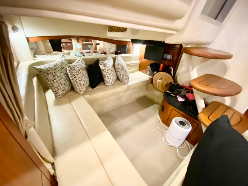 Slide: The Image of Interior of 2007 Sea Ray 340 Sundancer with cozy seating and decorative pillows. - 29