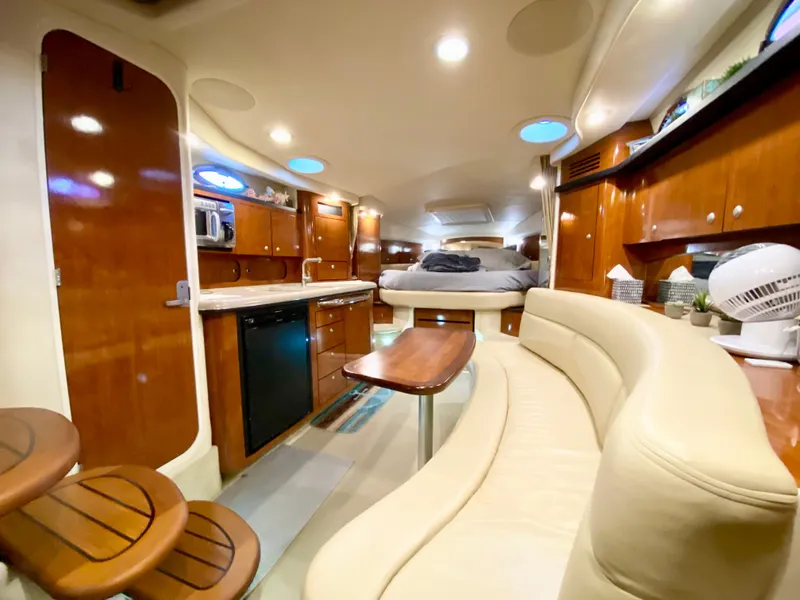 Slide: The Image of Interior of 2007 Sea Ray 340 Sundancer yacht with elegant wood finishes and cozy seating. - 31