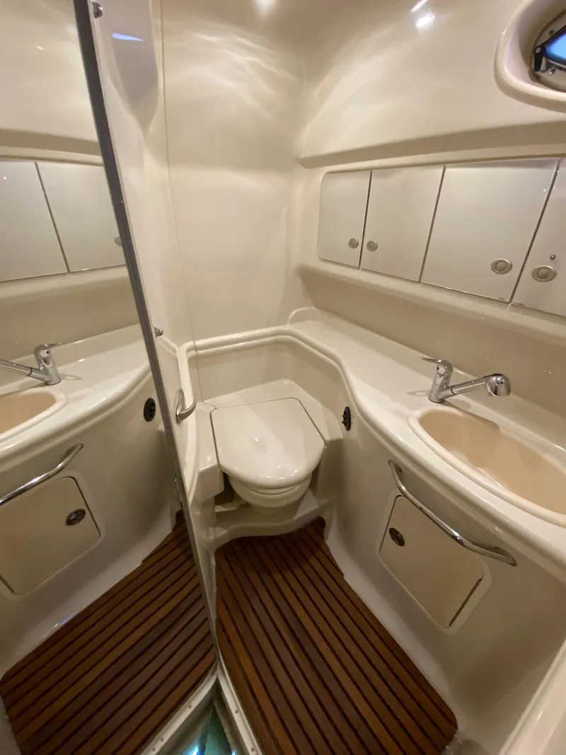 Slide: The Image of Luxurious 2007 Sea Ray 340 Sundancer bathroom with modern fixtures and wooden flooring. - 34