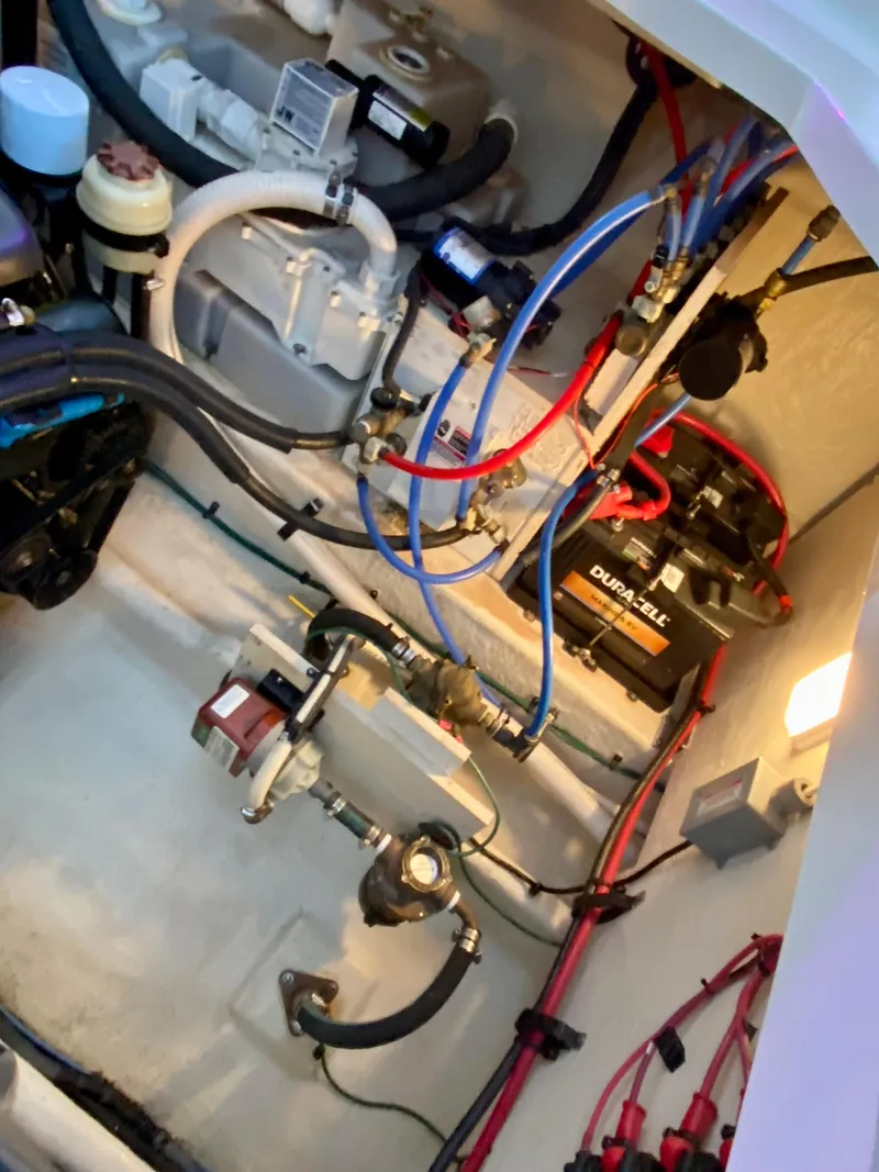 Slide: The Image of Engine compartment of 2007 Sea Ray 340 Sundancer with visible wiring and components. - 38