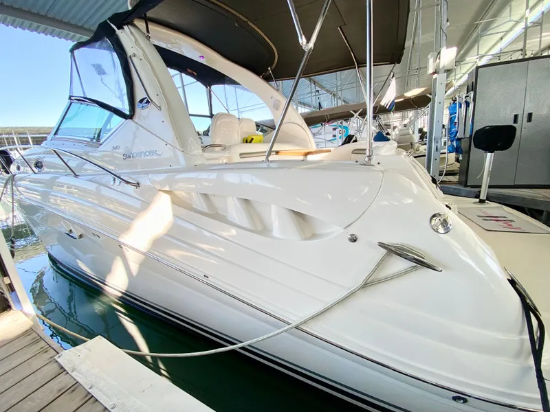 Slide: The Image of 2007 Sea Ray 340 Sundancer yacht docked in marina, side view. - 4