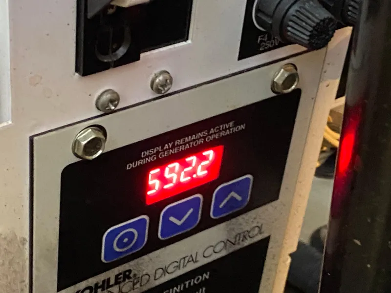 Slide: The Image of Kohler generator control panel on 2007 Sea Ray 340 Sundancer, displaying 592.2 hours. - 40