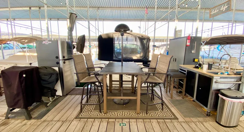 Slide: The Image of Outdoor dining setup on a docked 2007 Sea Ray 340 Sundancer yacht. - 41
