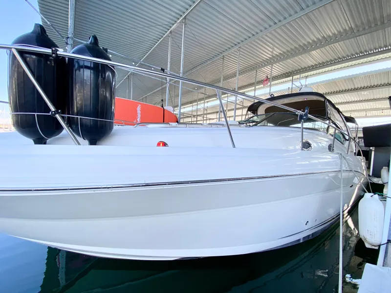 Slide: The Image of 2007 Sea Ray 340 Sundancer docked under a covered marina. - 5