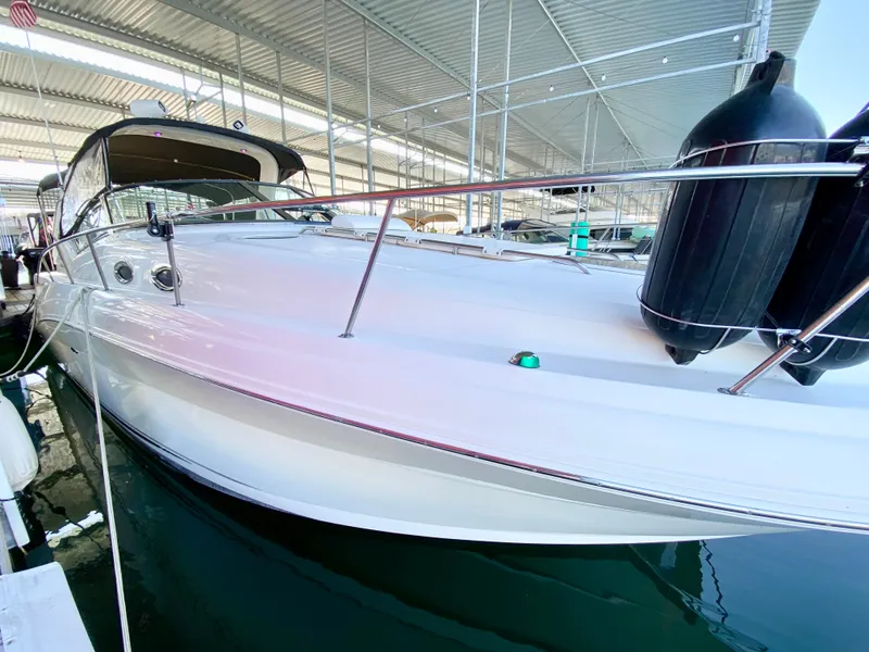 Slide: The Image of 2007 Sea Ray 340 Sundancer docked in a covered marina. - 6