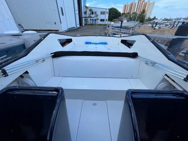 Slide: The Image of 1977 Riva 310 boat interior with seating, dockside view, and modern design elements. - 20