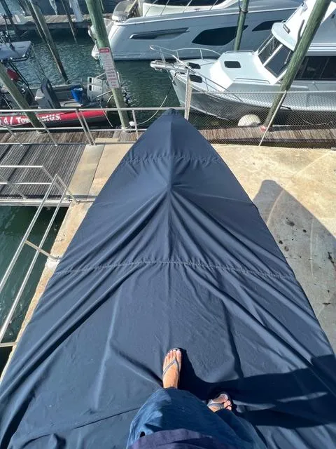 Slide: The Image of View from a covered 1977 Riva 310 boat docked at a marina. - 31