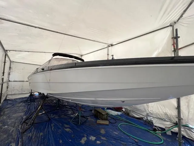 Slide: The Image of 1977 Riva 310 boat in storage tent, side view. - 32