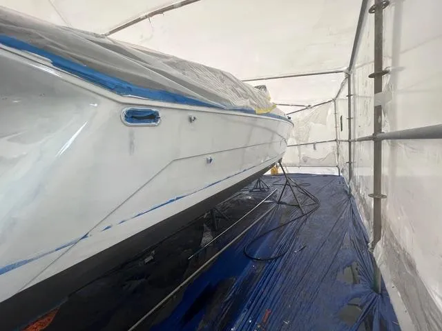 Slide: The Image of 1977 Riva 310 boat under protective cover in storage. - 35