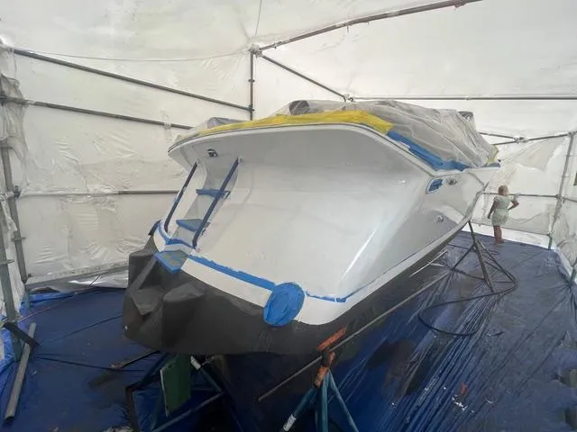 Slide: The Image of 1977 Riva 310 boat undergoing restoration in a covered workshop. - 36