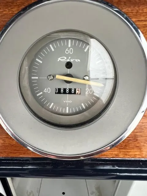 Slide: The Image of Vintage 1977 Riva 310 speedometer with wooden dashboard background. - 37