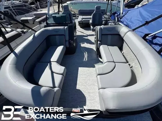 Slide: The Image of 2025 Bennington 22MSBSE pontoon boat interior with gray seating, showcased by Boaters Exchange. - 10