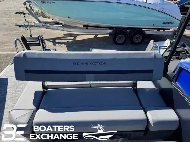 Slide: The Image of 2025 Bennington 22MSBSE boat seating at Boaters Exchange, with a Yamaha boat in the background. - 4