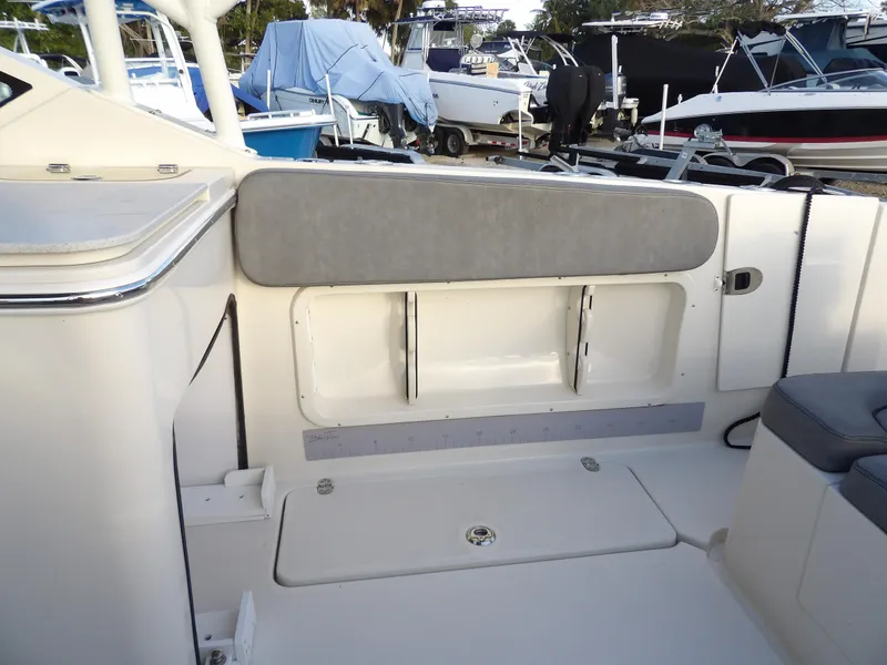 Slide: The Image of 2022 Stingray 269 DC boat interior with seating and storage compartments. - 20