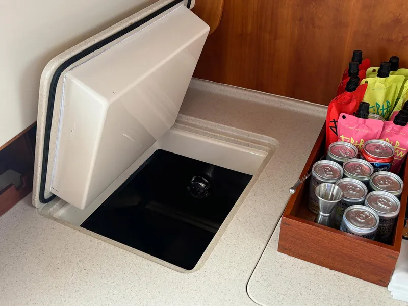 Slide: The Image of Hinckley Talaria 44 MY 2005 yacht interior with storage compartment and beverage holder. - 10