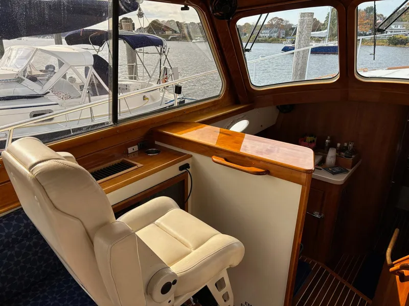 Slide: The Image of Interior of 2005 Hinckley Talaria 44 MY yacht with helm seat and wooden accents. - 13