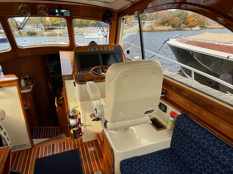 Slide: The Image of Interior of 2005 Hinckley Talaria 44 MY yacht with helm and seating area. - 16